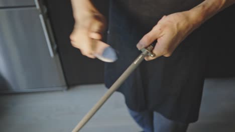 chef's hand sharpening knife with honing steel - kitchen equipment and utensils