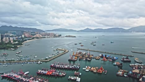 Panoramic-aerial-view-over-Castle-Peak-Bay-typhoon-shelter,-Tuen-Mun,-Hong-Kong