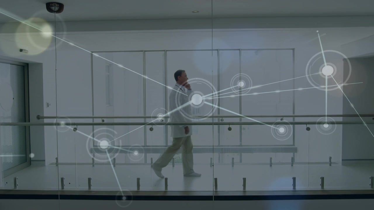 Animation of network of connections over male doctor in hospital