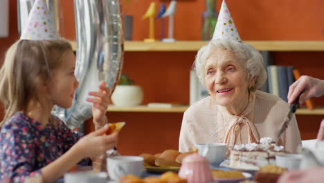 grandmother and grandchildren celebrating birthday