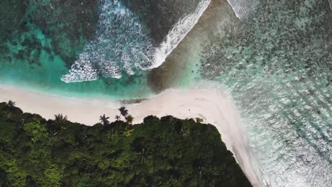 Drone-top-down-view-of-a-pristine-deserted-beach-in-the-Maldives