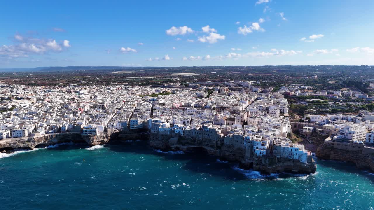 Polignano a Mare coastal city with majestic caves, aerial high altitude view