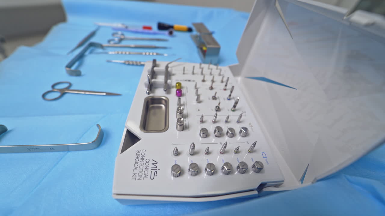 Dental equipment on background. Close up of dentist hands picking up dental equipment