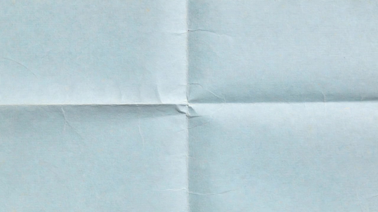 Looping playback showing folded pale sheet filling frame, showing cross folds and central pinch