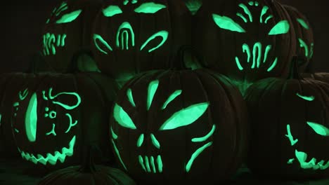 a spooky display of glowing jack-o'-lanterns featuring intricate and unique designs perfect for halloween celebrations and festive decorations
