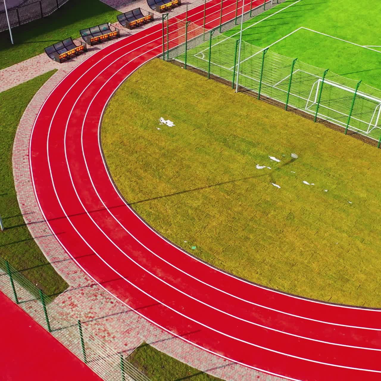 Modern sports grounds. Flight over colorful stadiums with nobody. Modern fields for playing different sport outdoors