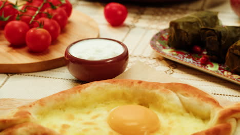 adjarian khachapuri with dolma and yogurt