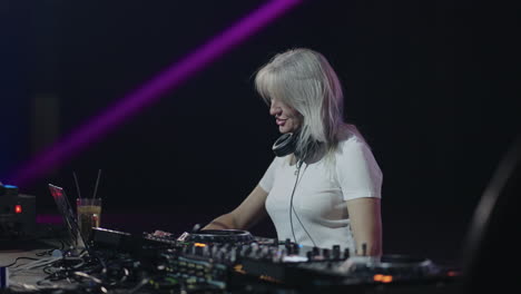 female dj performing at a nightclub