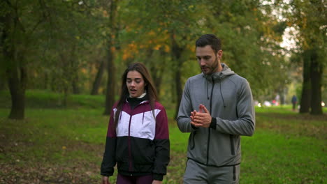 couple walking in the park on an autumn day
