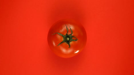 rotation tomato on a red background.