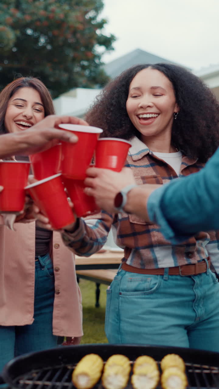 Happy Friends Toasting with Red Cups at a Backyard Barbecue Party