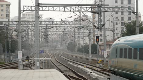 empty train station platform with high-speed train