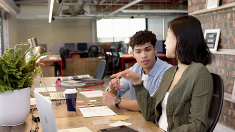 interior design project, multiracial colleagues collaborating with laptop and materials in office