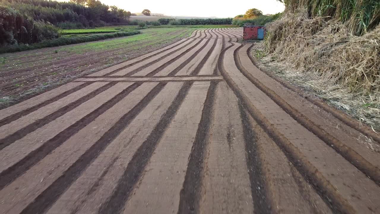 Agriculture field ready for planting, drone view going forward