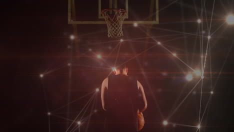 animation of networks of connections over mixed caucasian basketball player at gym