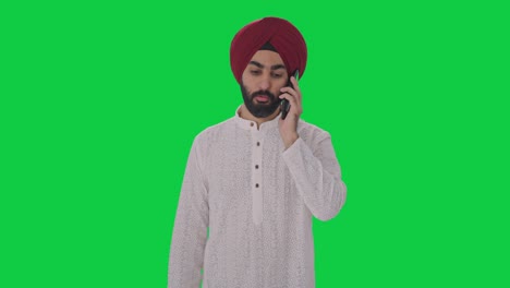 sikh indian man talking on phone green screen