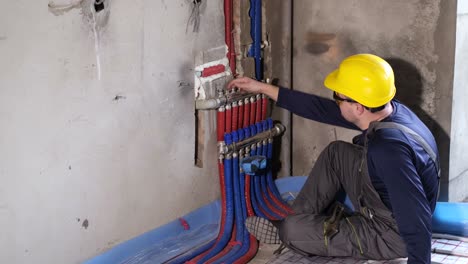 plumber installing underfloor heating system