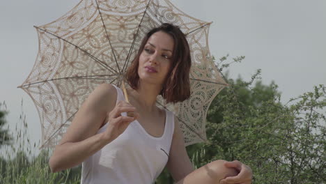 young woman outdoors in the countryside relaxing