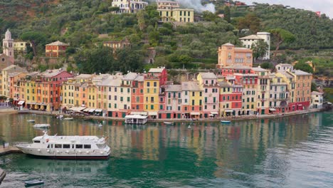 luxurious cruise yacht mooring in harbor of picturesque portofino town