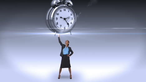 Businesswoman-holding-giant-alarm-clock