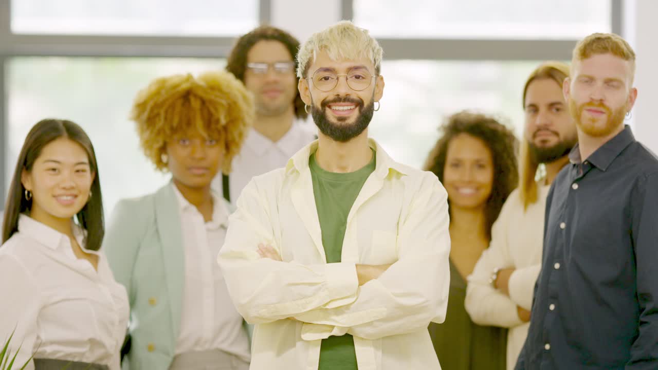 Leader and teamwork smiling at camera and standing proud