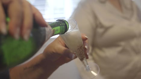 Champagne-being-poured-for-bridesmaids