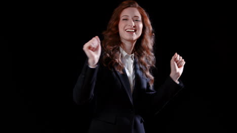 a caucasian businesswoman having a victory dance