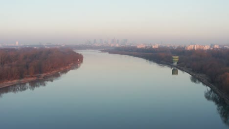 flying over vistula riwer. warsaw during foggy morning
