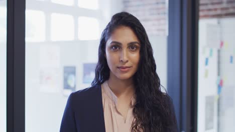 Portrait-of-woman-smiling-at-office