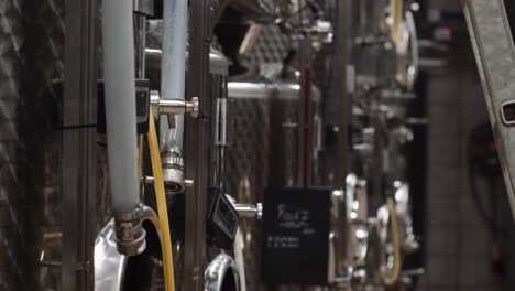 shallow focus tilt-up shot of wine tanks used in the wine-making process