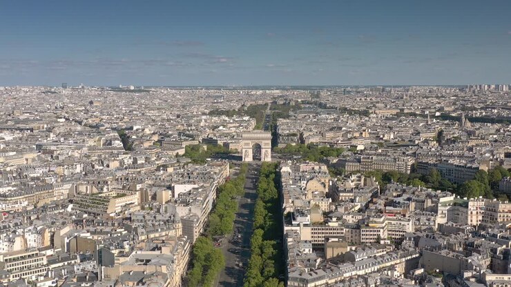 sunny day flight over paris city famous traffic avenue arch square aerial panorama 4k france