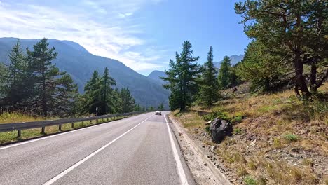 mountain road with scenic views and passing cars