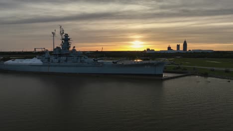 Aerial-reverse-reveal-of-the-USS-Alabama-and-the-city-of-Mobile-in-the-background