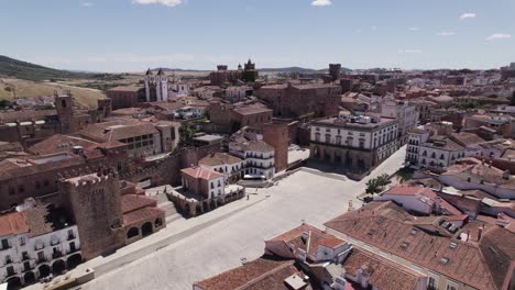 Aerial-out:-Plaza-Mayor,-Cáceres,-showcasing-its-historic-charm,-Spain