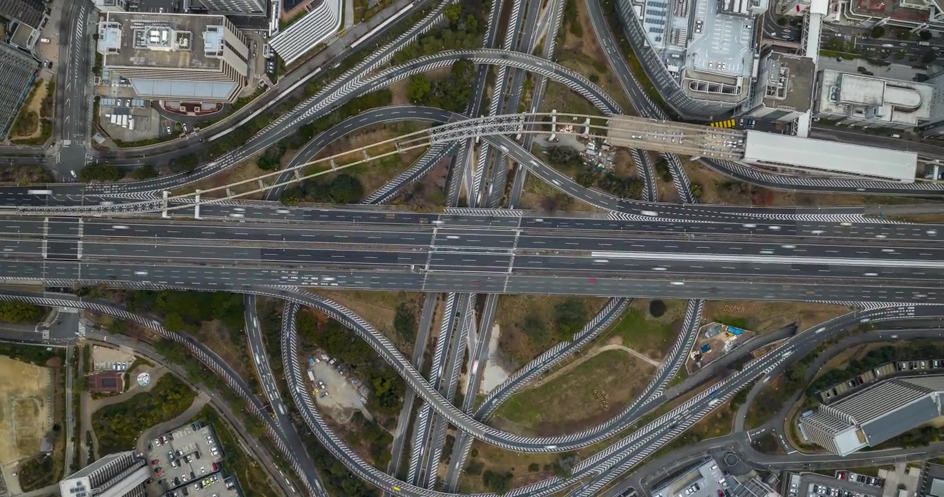 Rotating birds eye view day timelapse of highway crossing in Japan, Osaka