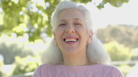 Portrait-of-happy-senior-biracial-woman-at-balcony-at-home,-slow-motion,-copy-space