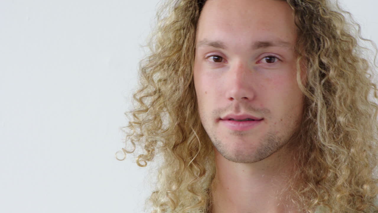 Portrait of a joyful young man laughing