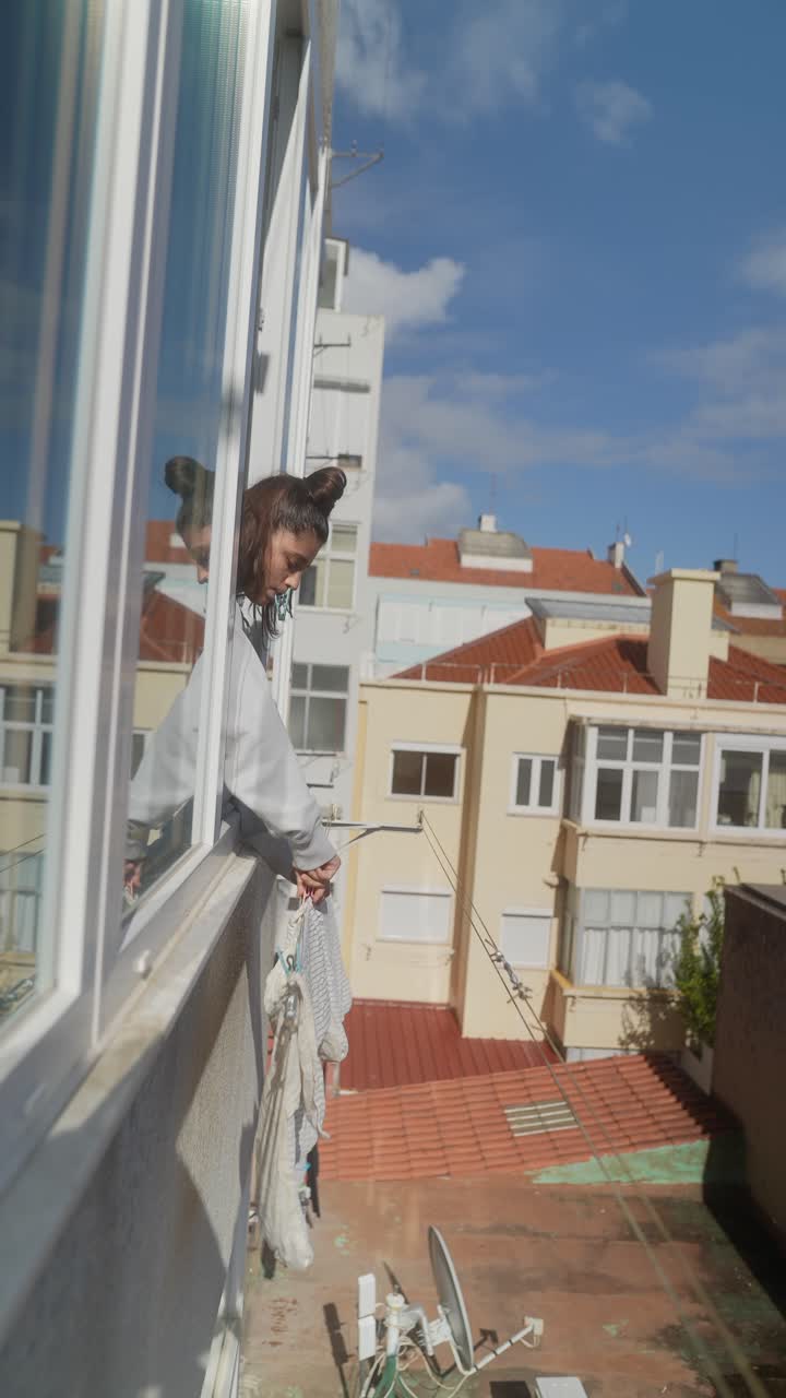 Woman Looking Out Window, Cityscape View