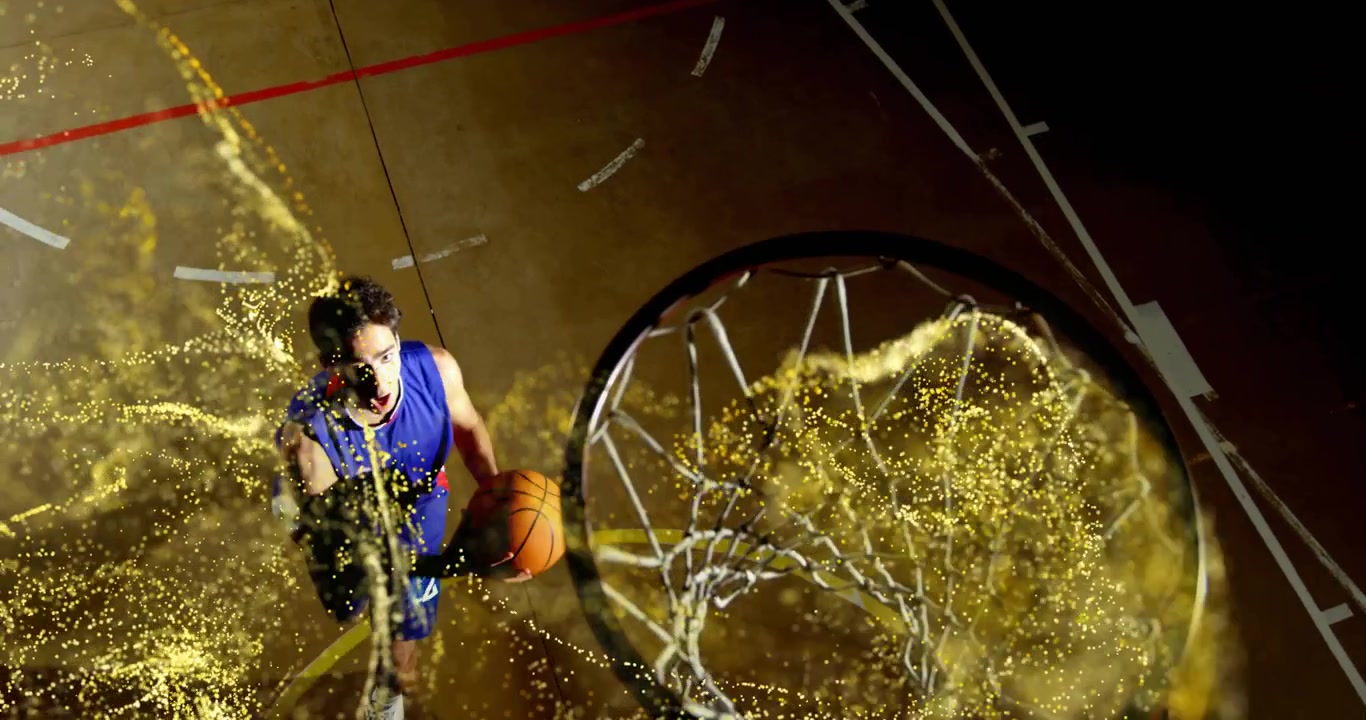 Basketballspiller dribler mod kurven, aktiverer en gylden partikelbue og udfører et dunk på en mørk bane