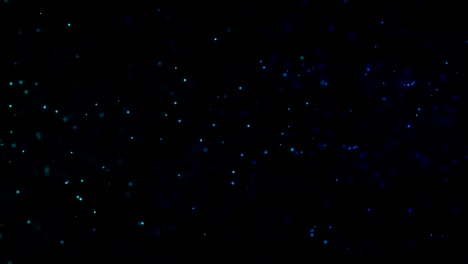 las partículas de polvo abstractas de fondo. las partículas de bokeh de fondo, las partículas parpadeantes, el movimiento aleatorio de las partículas.