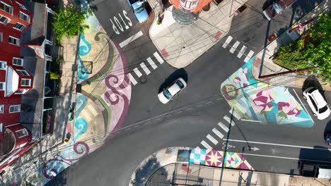 colorful crosswalks with street mural in urban city