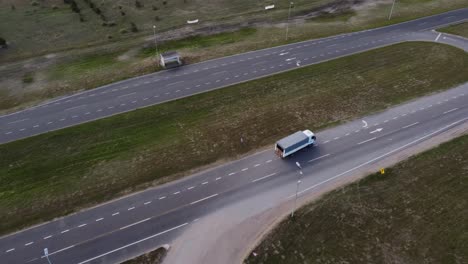 isolated truck driving from rural road to main route, mar de las pampas in argentina