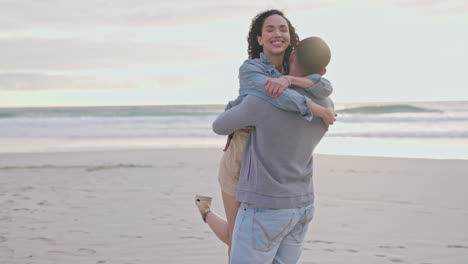 Hug,-lifting-and-happy-couple-at-a-beach