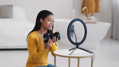 woman vlogging with dslr camera