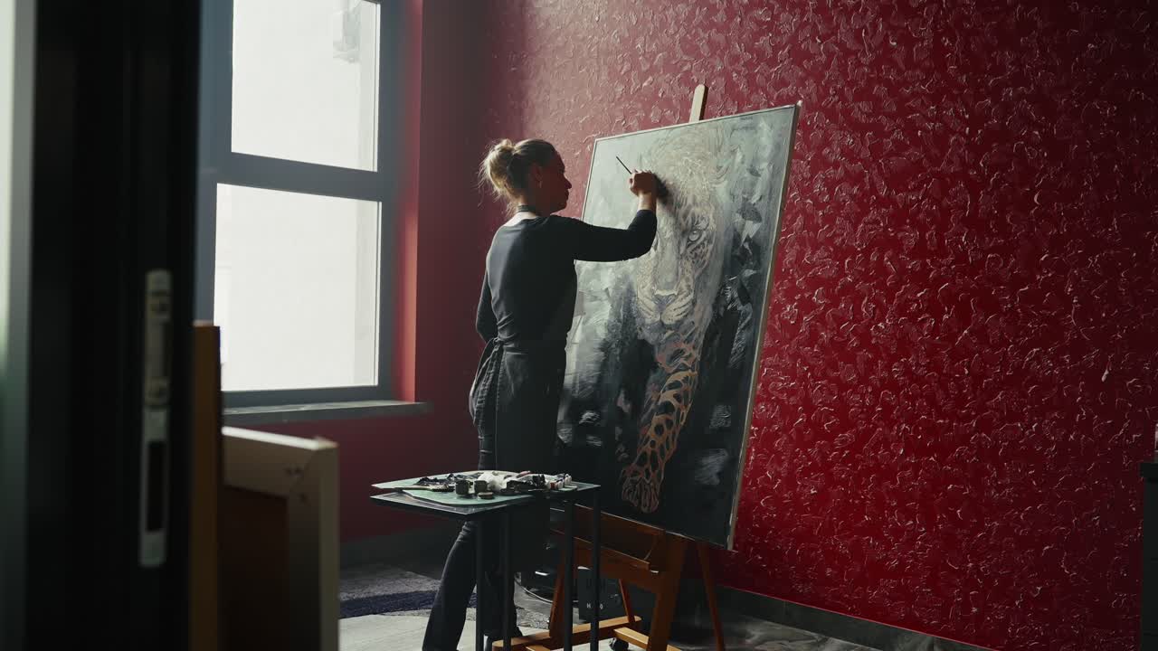 Artist Painting a Leopard Portrait in a Studio