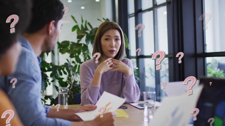 Animazione di punti interrogativi su diversi professionisti in riunione in ufficio