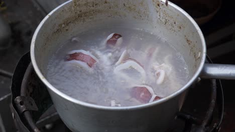 boiling squid in water at street food restaurant