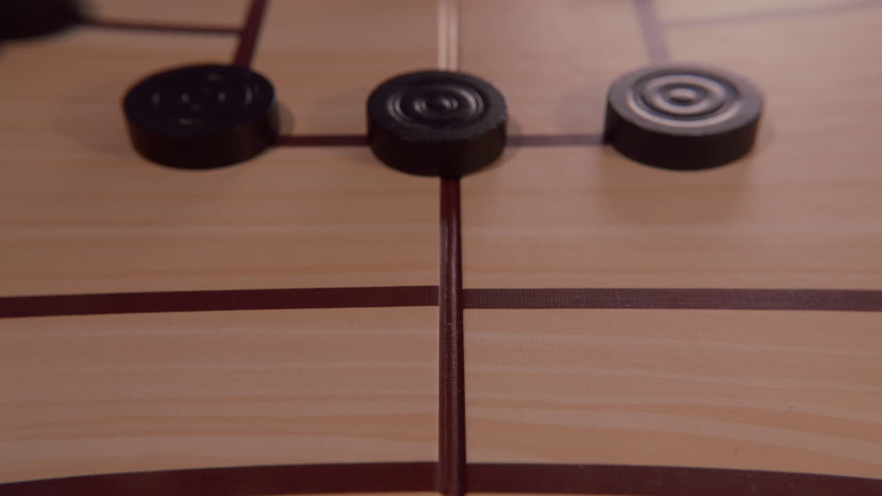 Hand Playing Nine Men's Morris Board Game