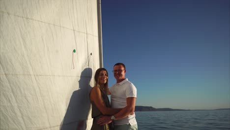 couple embraces a sunset sailing adventure