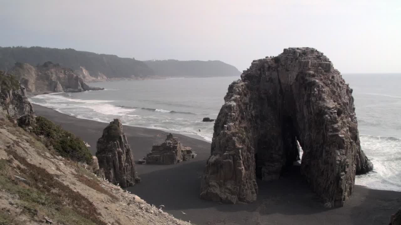 Huge Rocks And Ocean, Piedra De La Iglesia, South Chile - wide shot ...